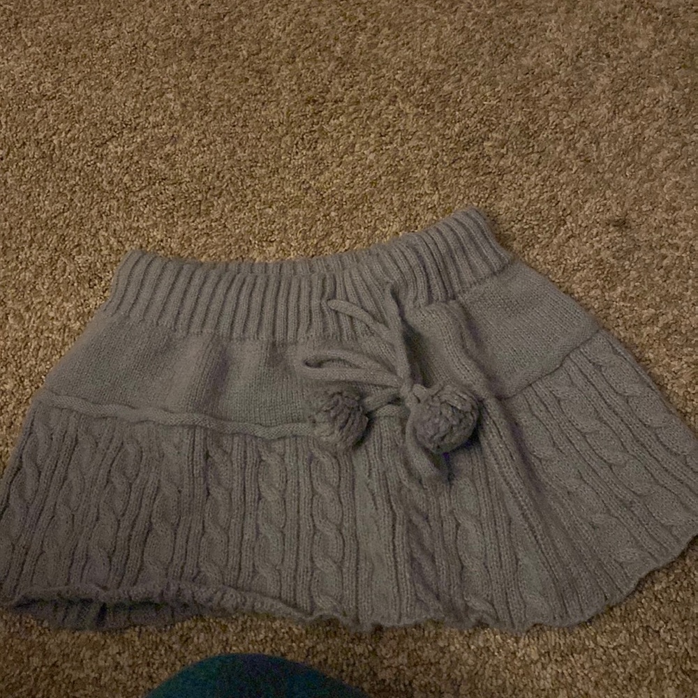 Knitted mini skirt with Pom poms